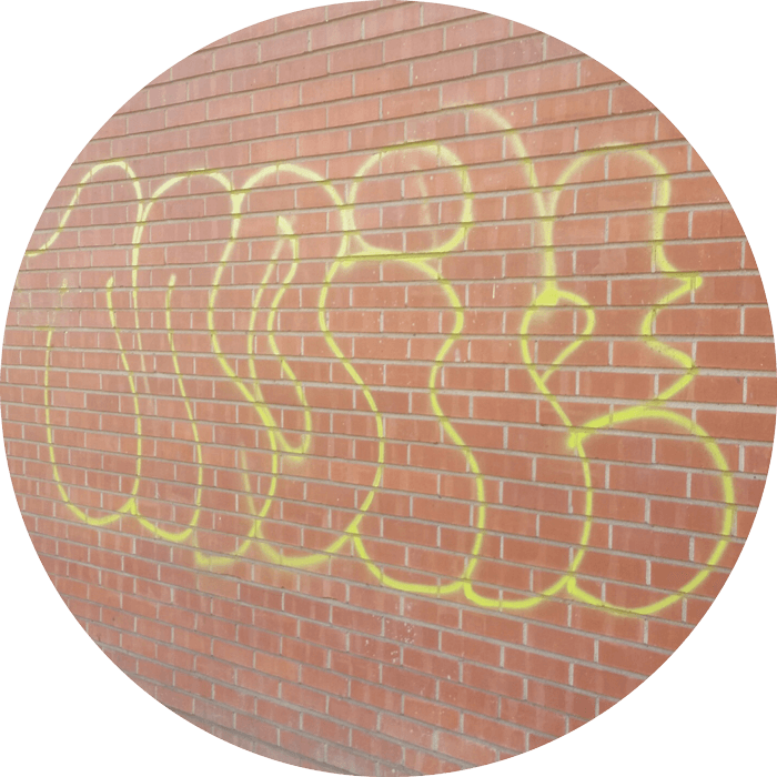 Brick wall with graffiti